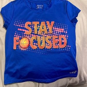 Blue and pink “stay focused” sports shirt.